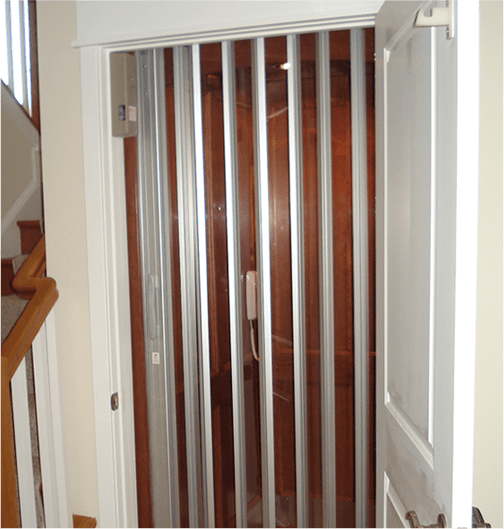 open hinged door to closed glass panel accordian style door to residential elevator
